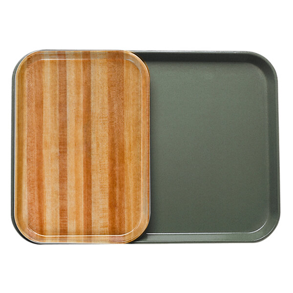 A Cambro fiberglass cafeteria tray with a wooden butcher block insert.