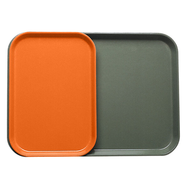A close-up of an orange rectangular Cambro tray with an orange and grey insert.