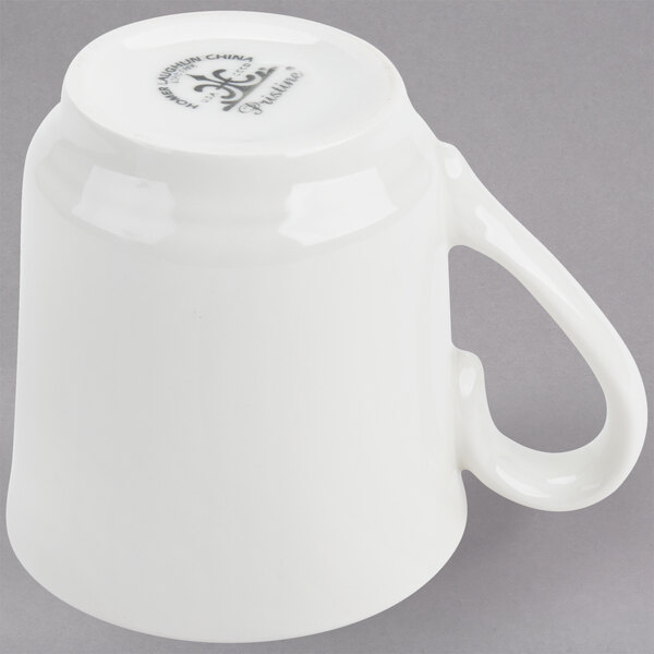 A Homer Laughlin bright white china tea cup with a handle.