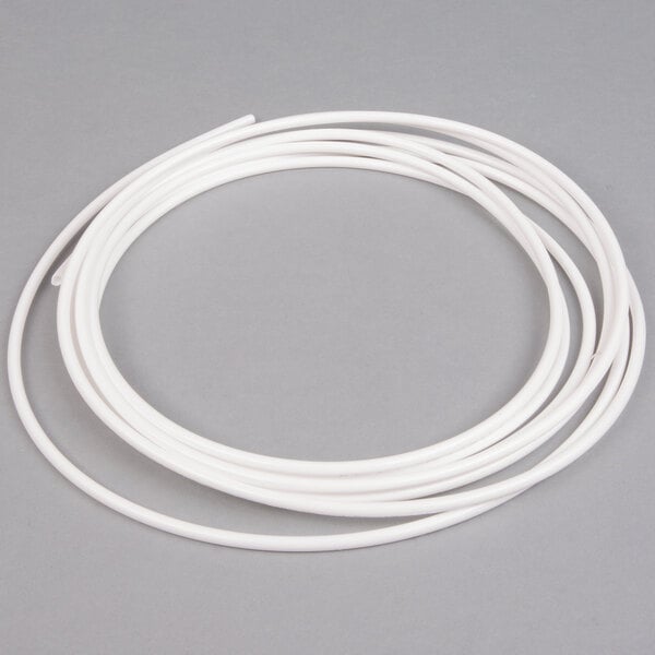 A white plastic tube with a white wire.