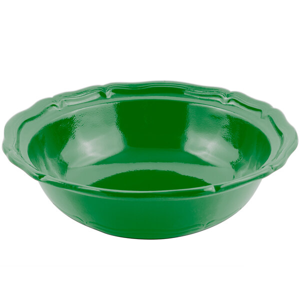 A green Bon Chef Queen Anne salad bowl with a scalloped edge.