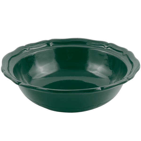 A Bon Chef Queen Anne hunter green cast aluminum salad bowl with a scalloped edge.