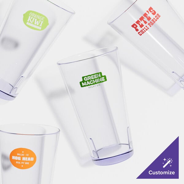 A group of clear plastic mixing glasses with a close-up of one.