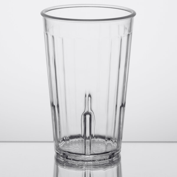 A clear plastic tumbler with a straw.