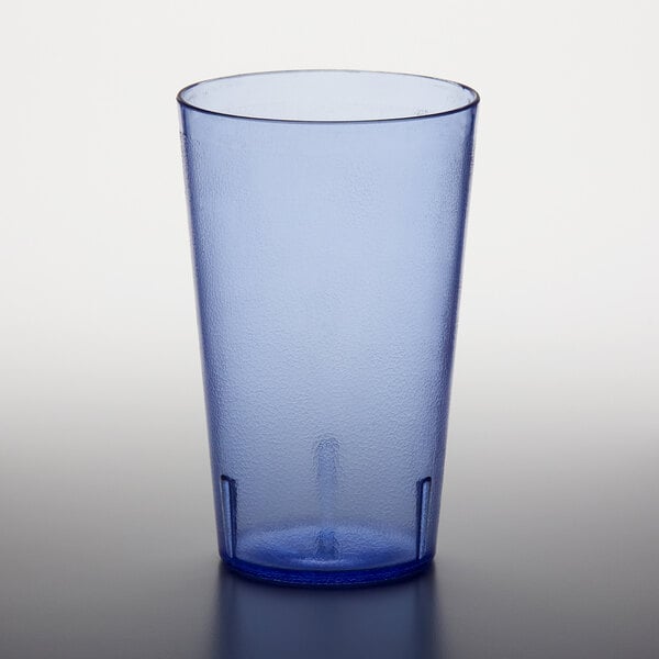 A close up of a blue GET plastic tumbler on a white surface.