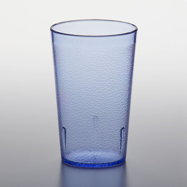 A blue plastic GET tumbler on a white surface.