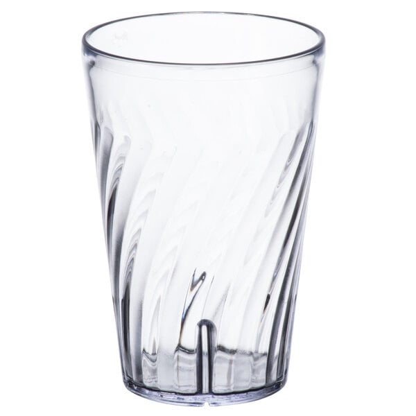 A clear plastic tumbler with a curved design.