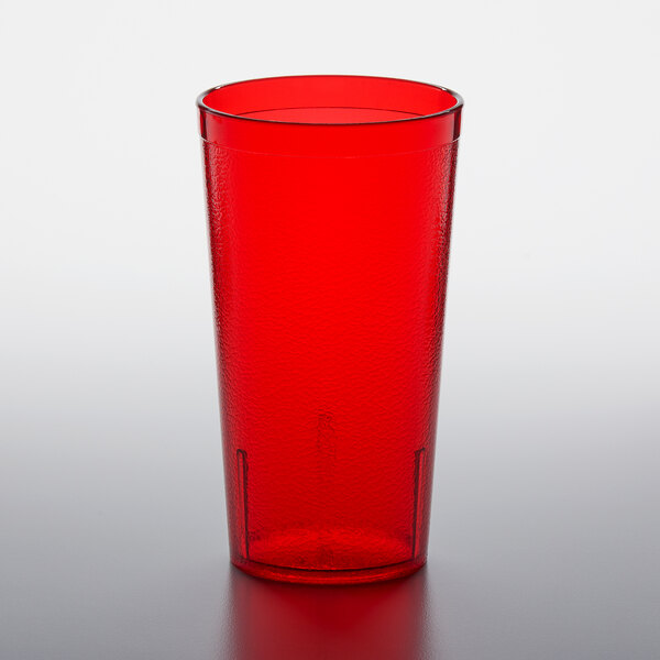A red plastic GET tumbler on a white surface.