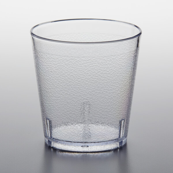 A clear plastic GET tumbler with a pebbled surface and small rim.