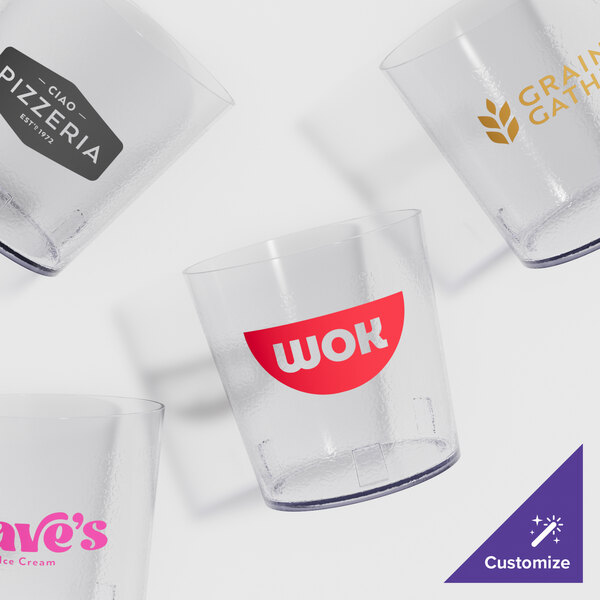 A group of clear plastic pebbled tumblers with a red logo on one.