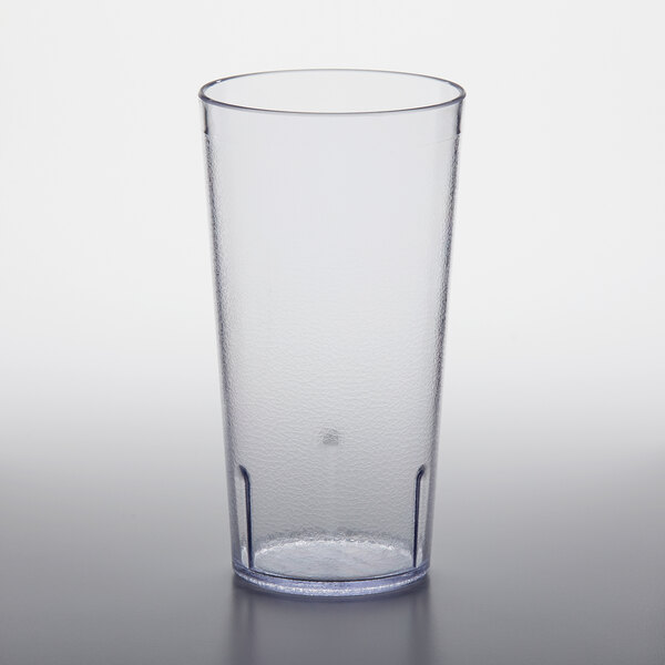 A clear plastic GET tall tumbler on a white surface.