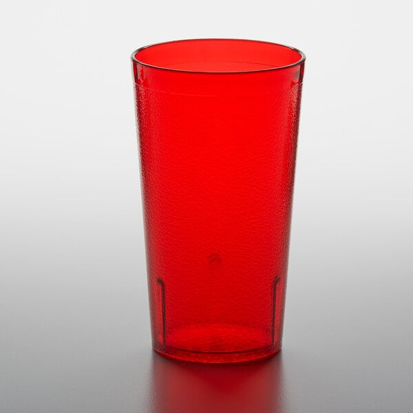 A red plastic GET tumbler on a white surface.