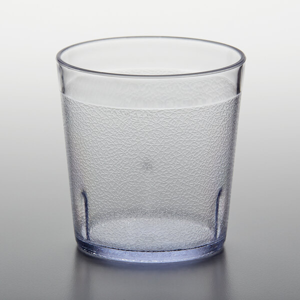 A clear plastic tumbler with a textured surface.