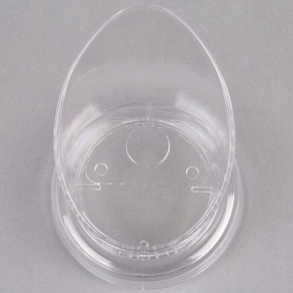 A clear plastic lid with a hole in the middle.