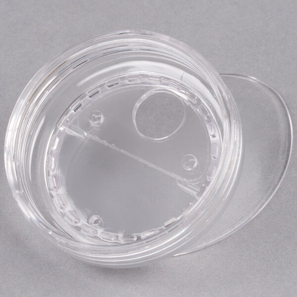 A clear plastic container with a small pour lid on it.
