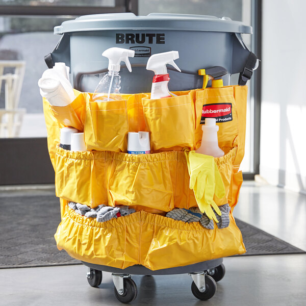 A Rubbermaid yellow caddy bag with cleaning supplies inside.