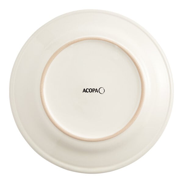 An Acopa ivory stoneware plate with a wide rolled edge and a white circle in the middle.