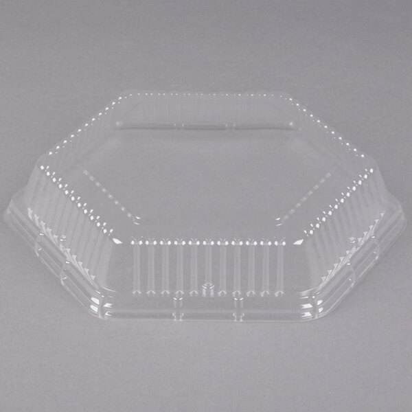 A Genpak clear plastic hexagonal lid on a clear plastic container.