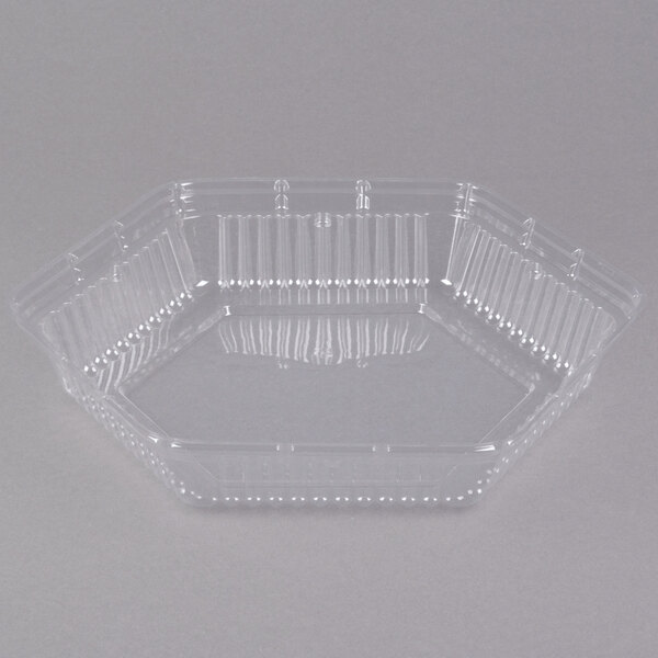 A clear plastic Genpak Smart-Set hexagonal lid on a clear plastic container.