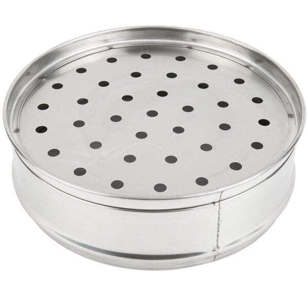A Town stainless steel dim sum steamer with holes in it.
