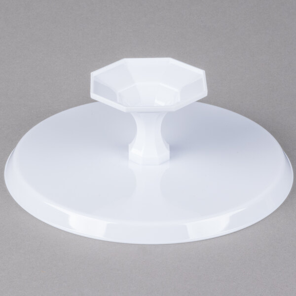 A white plastic pedestal with a hexagon-shaped base and a curved white plastic lid.