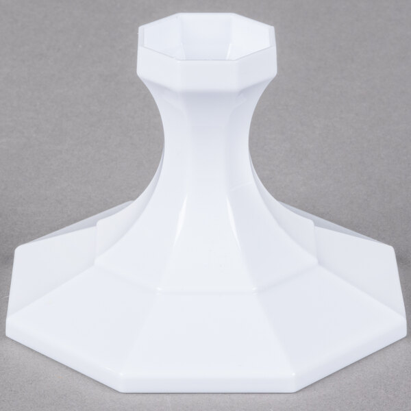 A white Fineline cake stand with a hexagonal base.