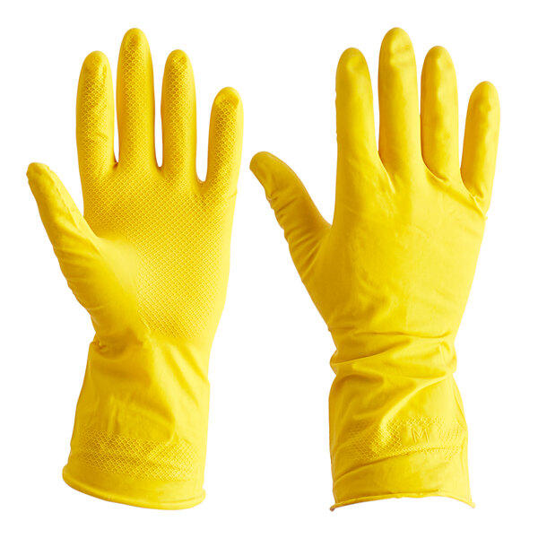 A hand wearing a yellow Cordova rubber glove.