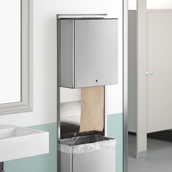 A stainless steel Bobrick paper towel dispenser and waste receptacle.