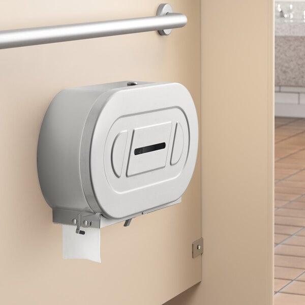 A Bobrick ClassicSeries twin jumbo roll toilet paper dispenser mounted on a wall.