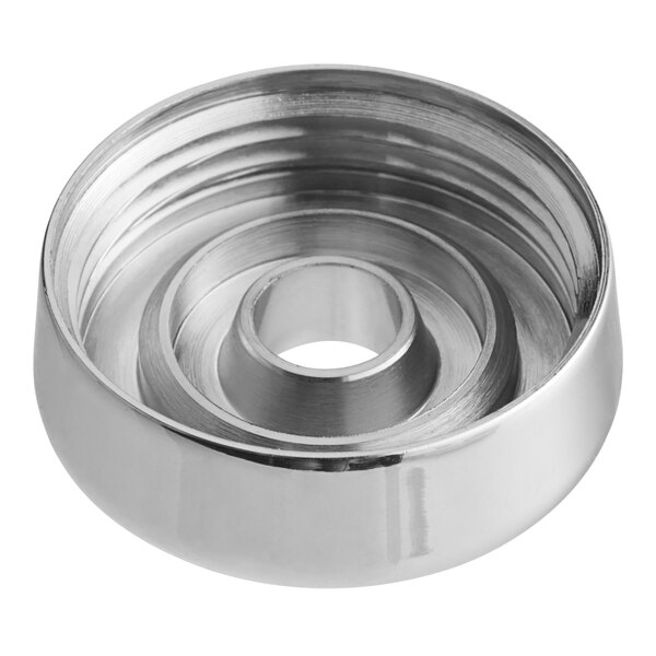 A silver circular object with a hole.