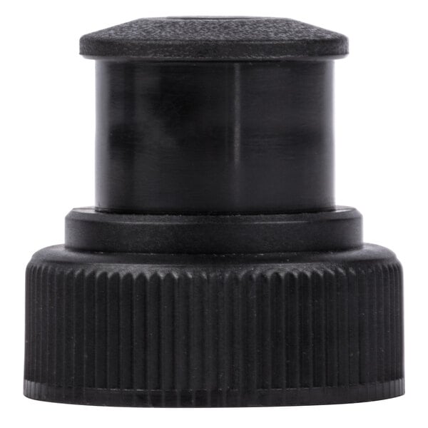 A close-up of a black plastic cap on a white surface.