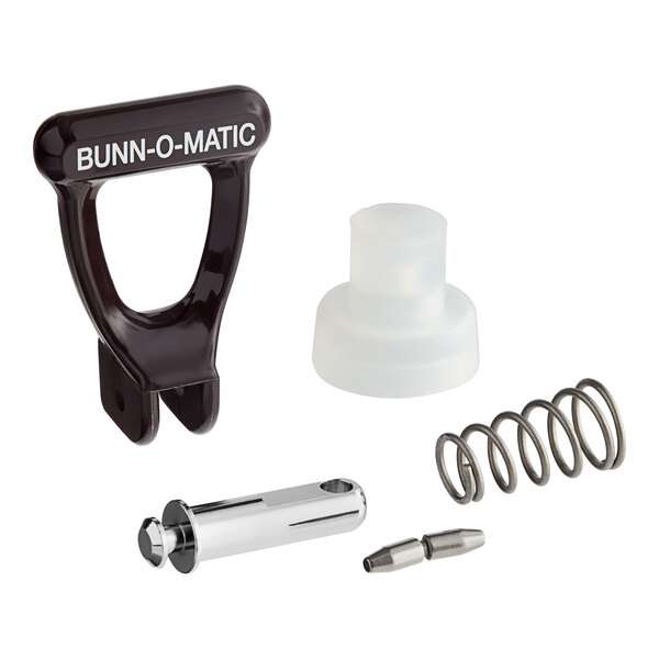 A Bunn faucet repair kit with a brown plastic handle and white text on a metal object.