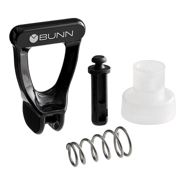 A Bunn faucet repair kit with a black and clear plastic object and a spring.