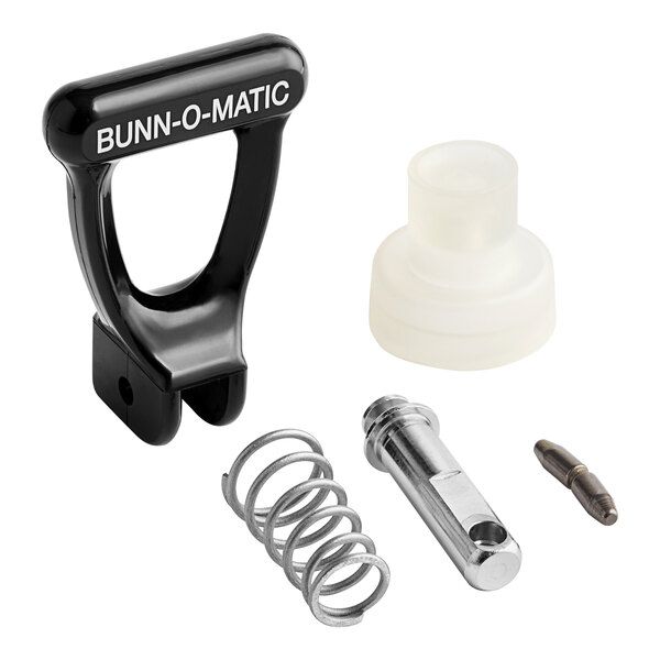 A Bunn faucet repair kit with a black and white handle, spring, and metal object.