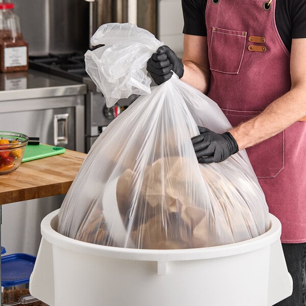 Berry AEP 385822C 55-60 Gallon 0.9 Mil 38" x 58" Low-Density Medium-Duty Clear Can Liner / Trash Bag - 100/Case