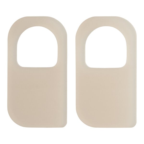 Two white rectangular Bunn faucet seals with a white circle in the center.