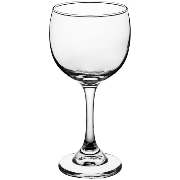 An Acopa clear wine glass with a stem.