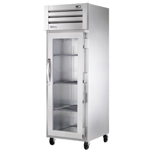 A True stainless steel reach-in holding cabinet with glass doors.