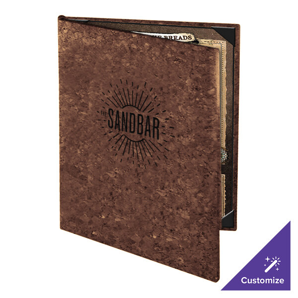 A brown cork-textured menu cover with 'The Sandbar' logo on the front, partially open to reveal inserted menu pages.