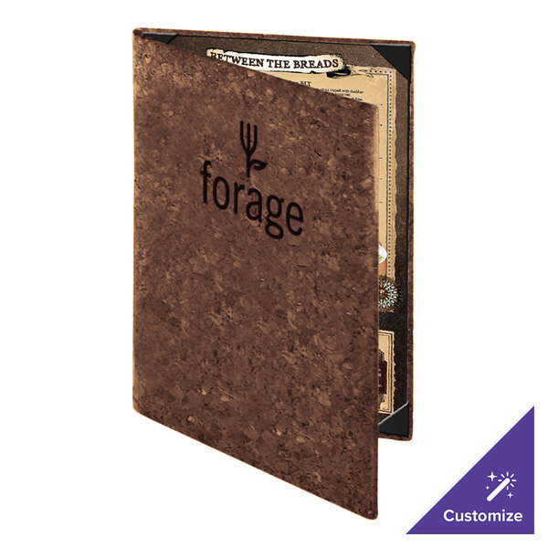 A brown cork-textured menu cover with the word 'forage' and a fork design on the front, partially open to reveal a menu inside.