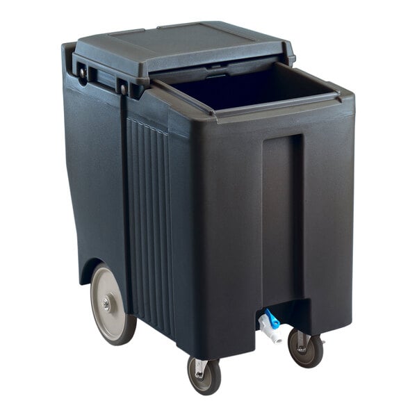 A large black mobile ice bin with a sliding lid and four wheels, two of which are larger for easier mobility.