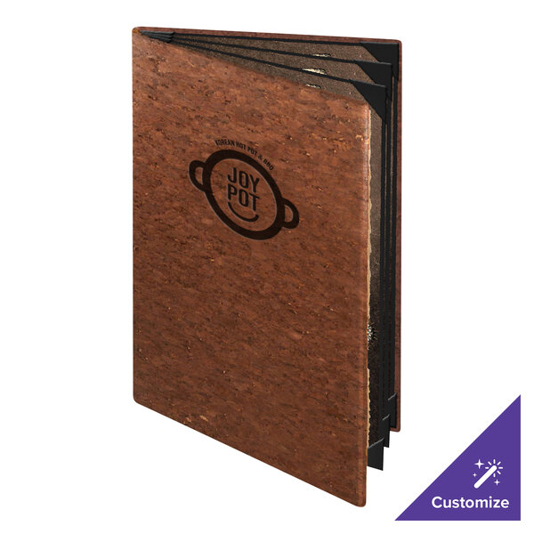 A brown, textured booklet with a visible logo on the front cover and multiple black-edged pages inside.