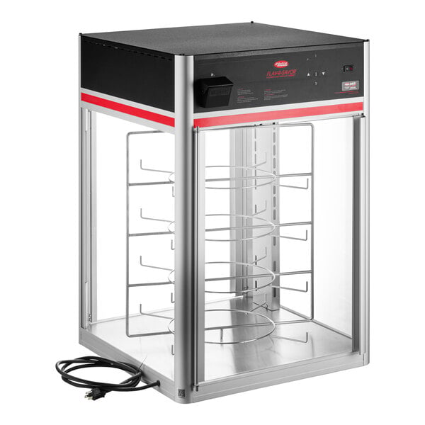 A tall, two-door Hatco Flav-R-Savor holding and display cabinet with a four-tier circular rack and an electric cord.