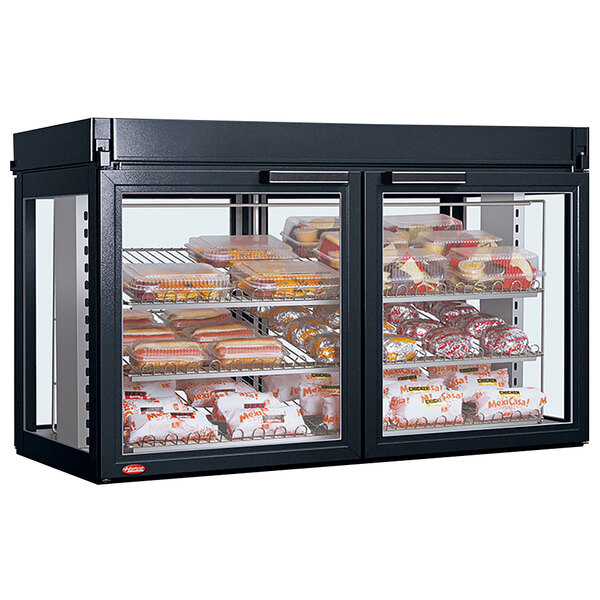 A Hatco Flav-R-Savor countertop display case with food inside.