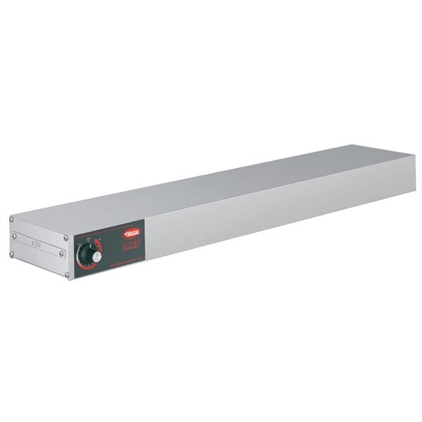 A rectangular stainless steel metal box with a red light and knob on it.