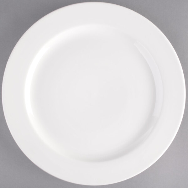 A Tuxton AlumaTux white china plate with a white rim.
