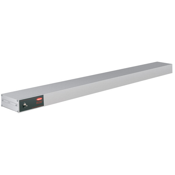 A long rectangular metal shelf with red lights on it.