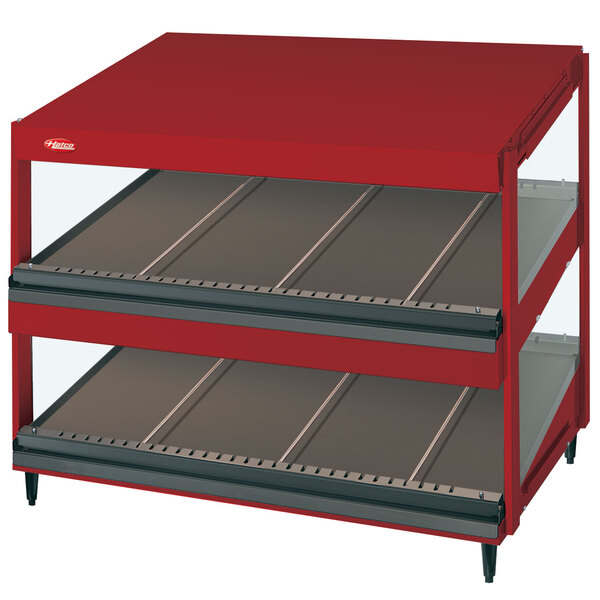 A red Hatco display case with slanted shelves.