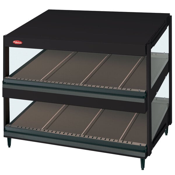 A black Hatco countertop display with two slanted glass shelves.
