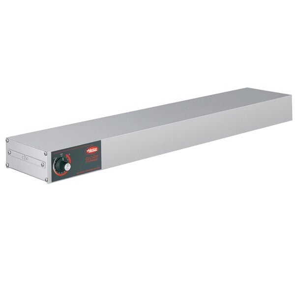 A long rectangular silver metal box with a red light and a black dial.